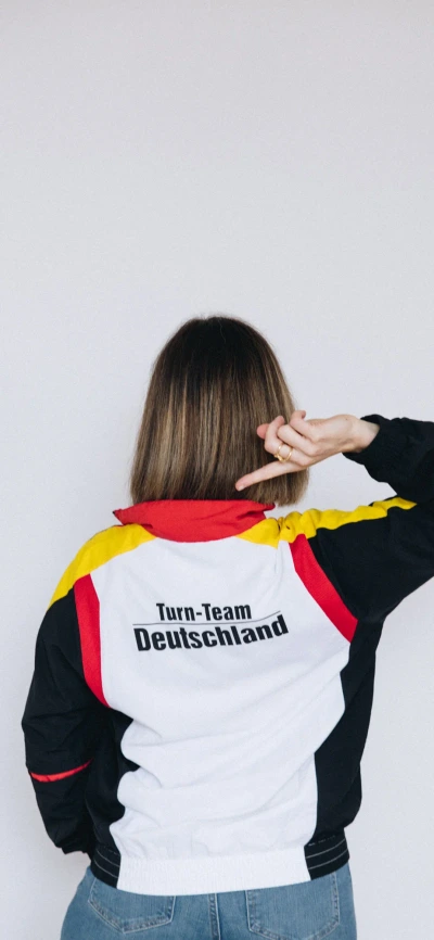 Anaïs from behind wearing the German gymnastics team jacket